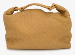 A Bottega Veneta mustard woven handbag