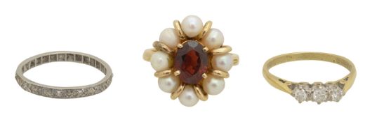 A 18ct diamond ring, and eternity ring and one other