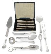A group of silver flatware