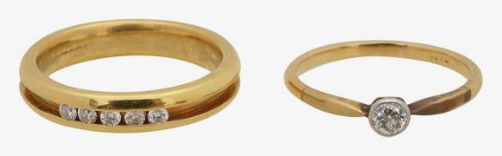 An 18ct diamond channel set ring and single stone