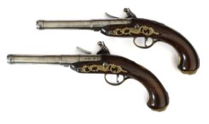 A fine pair of early 18th century flintlock pistols, by John Harman of London