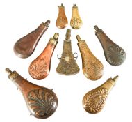 Ten Victorian brass and copper powder and shot flasks