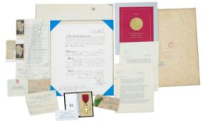 An O.B.E. awarded to John Henry Dobson Esq. with Elizabeth II and Prince Philip signed grant and oth