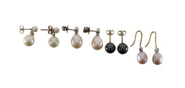 A collection of pearl and diamond ear drops
