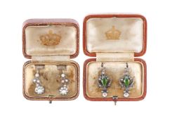 A pair of silver and pearl earrings, and another peridot pair