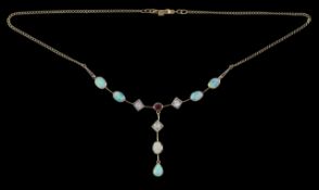 A diamond and opal drop pendant necklace