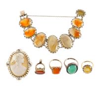 A shell cameo brooch, hard stone bracelet, fob and three rings