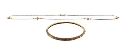 A Victorian garnet set hinged bangle