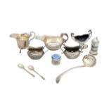 A collection of silver cruets, flatware and sauceboats