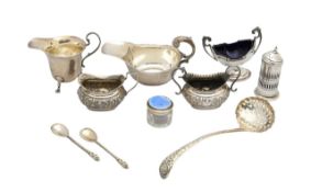 A collection of silver cruets, flatware and sauceboats