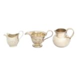 A group of three silver cream jugs