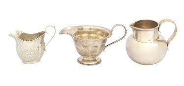 A group of three silver cream jugs