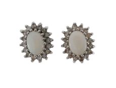 A pair of 9ct opal and diamond stud earrings