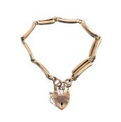 A 9ct gold three bar gate bracelet