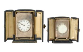 Two silver cased travel or carriage clocks