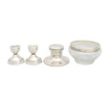 A silver inkwell, a pair of silver dwarf candlesticks, and a cut glass bowl