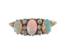 A three stone opal and diamond ring