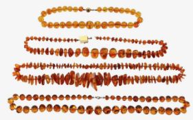 Four sets of amber beads