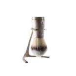 A Christopher Nigel Lawrence silver shaving brush and stand