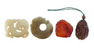 Two Chinese carved hardstone discs