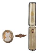 A shell cameo pin with motif and a mourning brooch