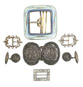 A collection of silver belt and shoe buckles