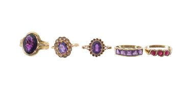 A collection of amethyst dress rings and one other