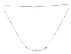 A Tiffany silver and 14ct gold Smile pendant