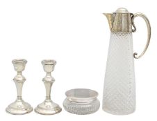 A silver mounted claret jug, dressing table jar and candlesticks