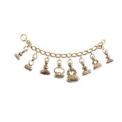 An 18ct gold bracelet with eight fob seal charms