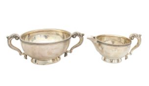 A George V silver sugar bowl and cream jug