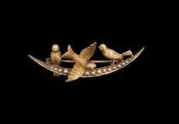 An early 20th century yellow gold and seed pearl brooch