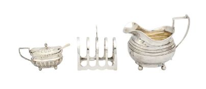 A George III silver cream jug, a toast rack, and a mustard pot