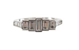 A platinum and baguette diamond ring