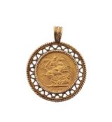 An Edward VII 1904 gold full sovereign in a 9ct gold mount