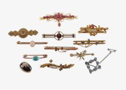 A collection of Art Deco and later brooches