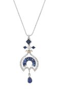 A platinum, diamond and sapphire heraldic style drop necklace