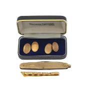 A pair of 9ct gold cufflinks, a 14ct gold clip and a 9ct gold pen knife