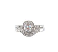 A diamond platinum ring and fitted diamond band