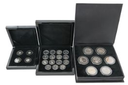 Three cased Elizabeth II coin sets