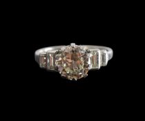A 2ct diamond solitaire ring with baguette side stones
