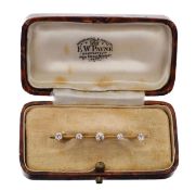 A diamond set bar brooch