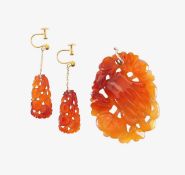A carnelian carved pendant and drop earrings