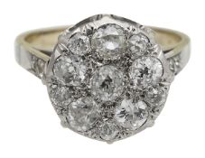 A diamond cluster ring with French control marks