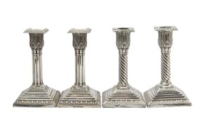 Two pairs of Victorian silver candlesticks