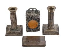 A pair of George V silver candlesticks, a silver carriage clock and a silver card case