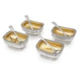 A set of four George III silver salts and spoons