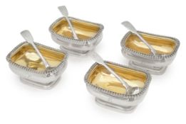 A set of four George III silver salts and spoons