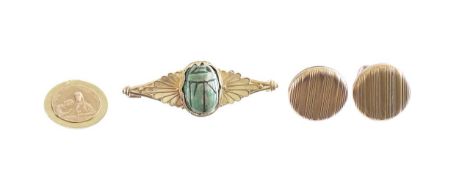 An Egyptian gold winged scarab beetle brooch, and a French gold medal