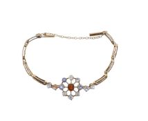 A sapphire and garnet floral bracelet